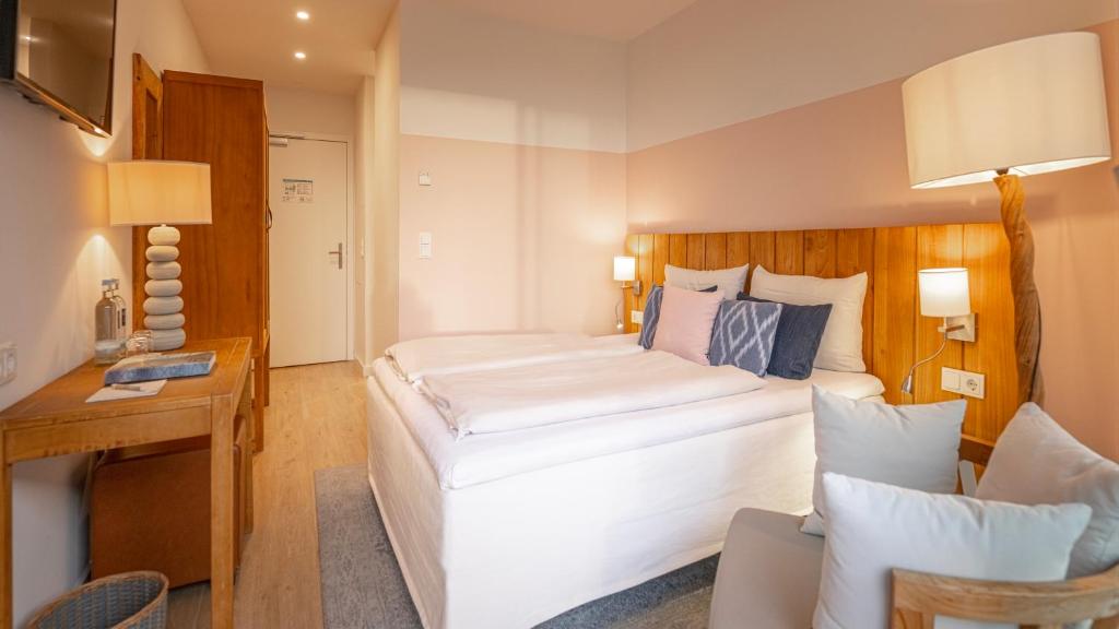 Postel nebo postele na pokoji v ubytování SAND Lifestylehotel