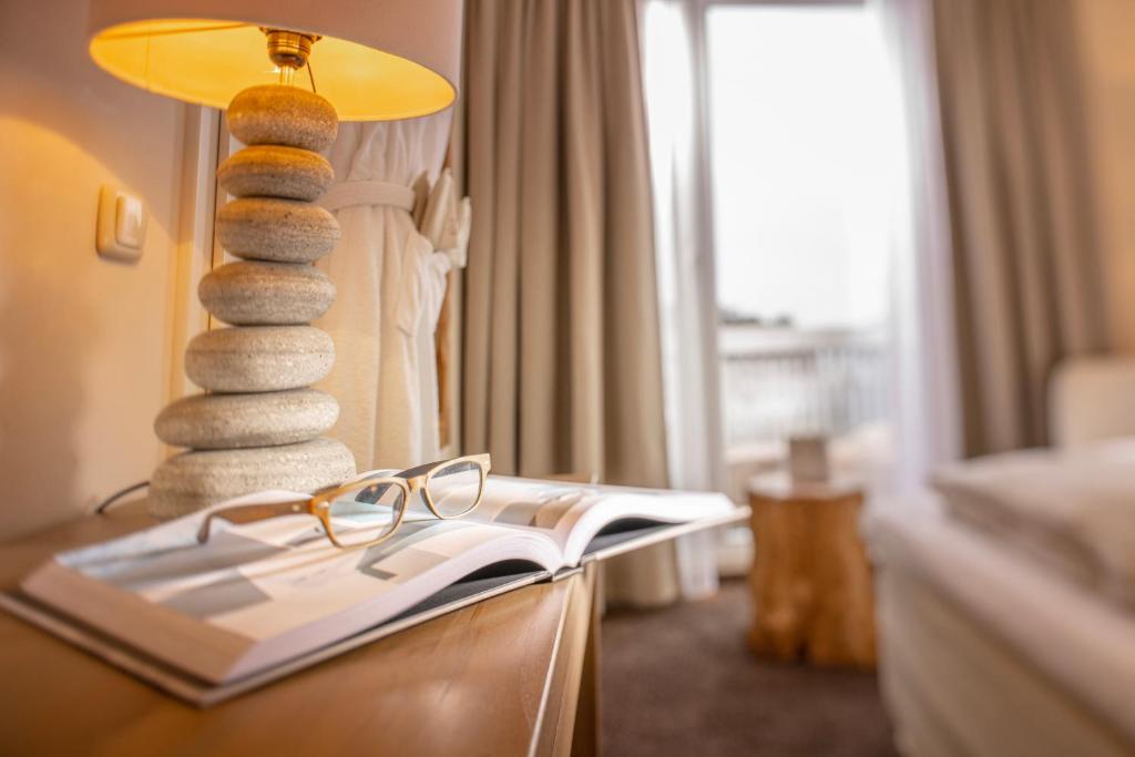 Postel nebo postele na pokoji v ubytování SAND Lifestylehotel
