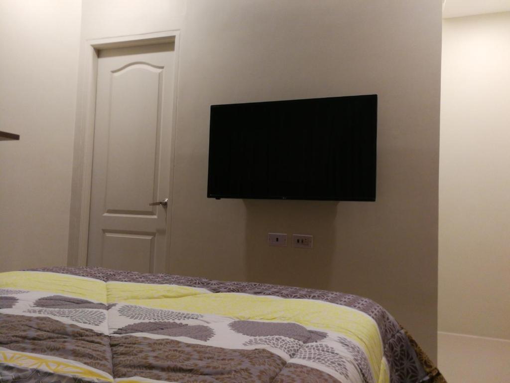 TV at/o entertainment center sa Adria Residences - Ruby Garden - 2 Bedroom for 4 person