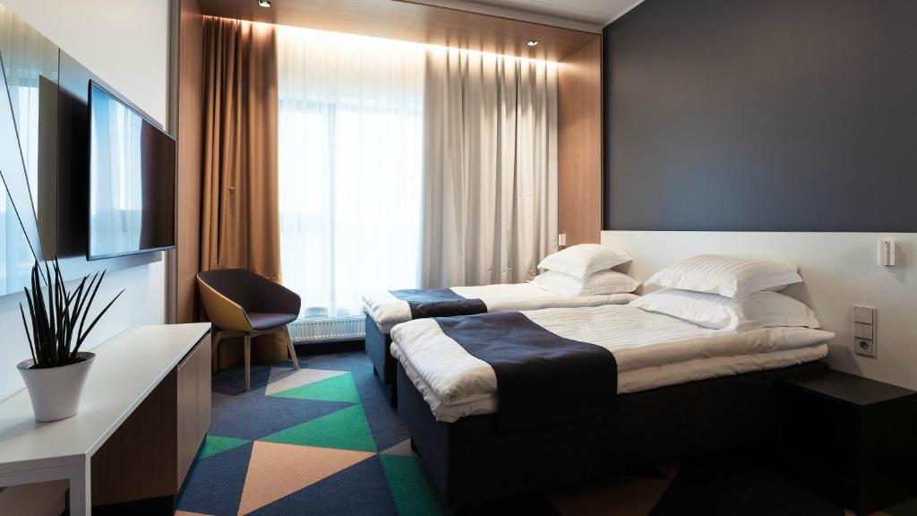 Postel nebo postele na pokoji v ubytování Hotel Sophia by Tartuhotels