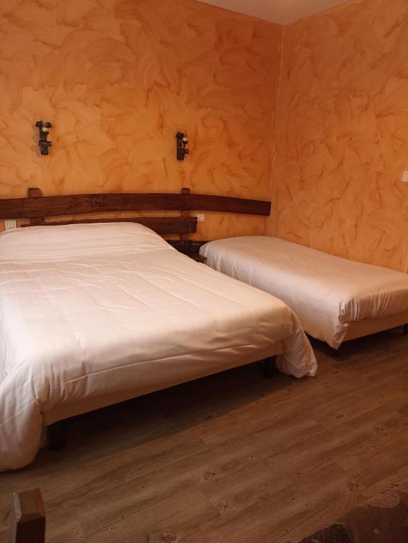 Postel nebo postele na pokoji v ubytování La Cremaillere