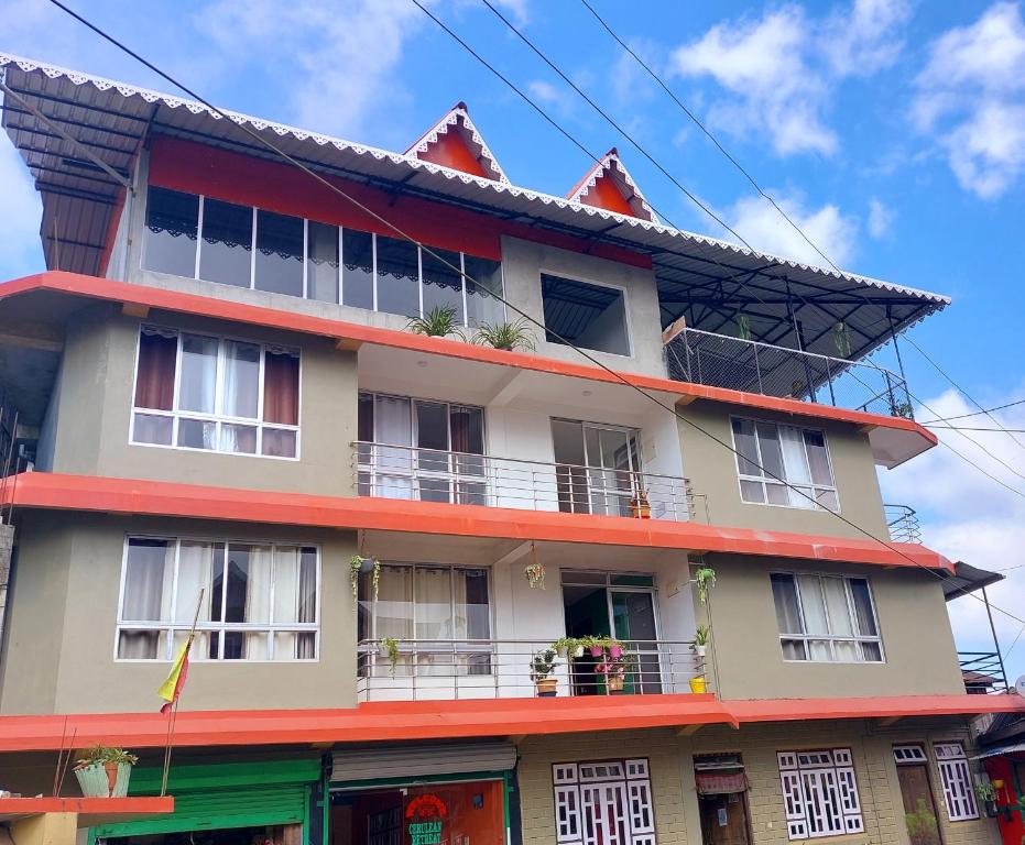 a building with red and white at CERULEAN RETREAT in Lava