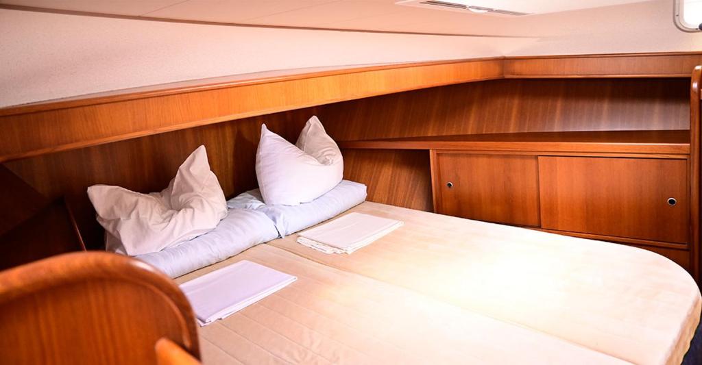 Postel nebo postele na pokoji v ubytování Kuhnle-Tours Hafendorf Müritz