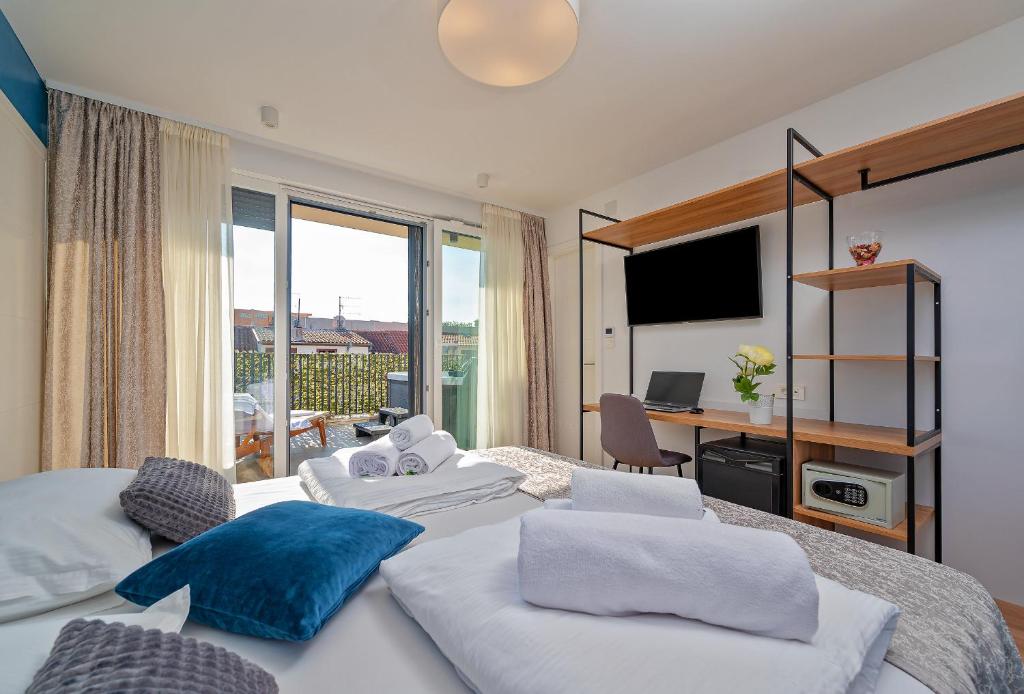 Posteľ alebo postele v izbe v ubytovaní Seven Seas Residence