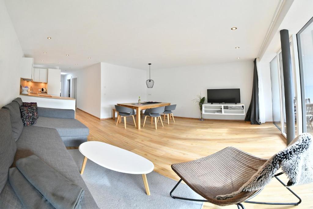 a living room with a couch and a table at Veranda Appartement Wohlfühl in Gries im Sellrain