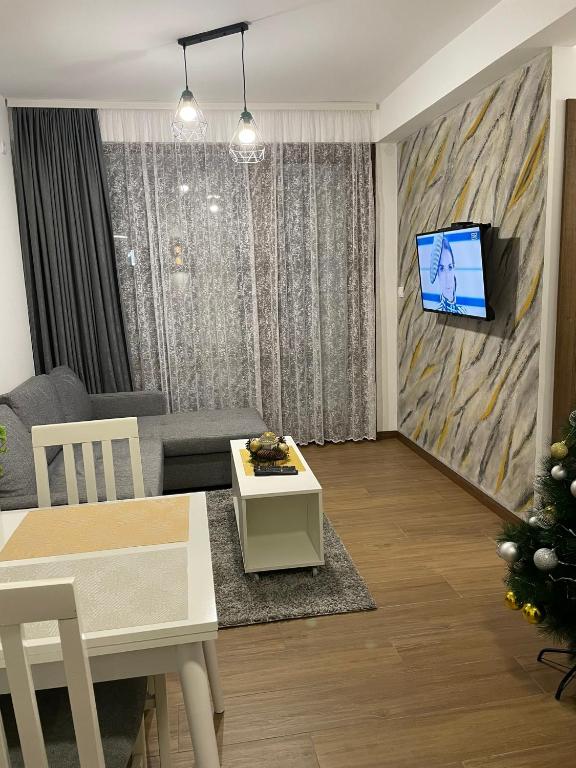 TV a/nebo společenská místnost v ubytování D-moll Divcibare