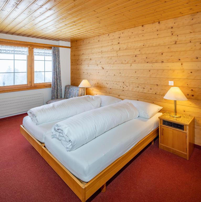 Postel nebo postele na pokoji v ubytování Hotel und Restaurant Chäseren