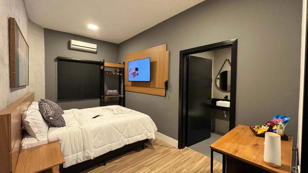 Cama ou camas em um quarto em Hotel La Serena