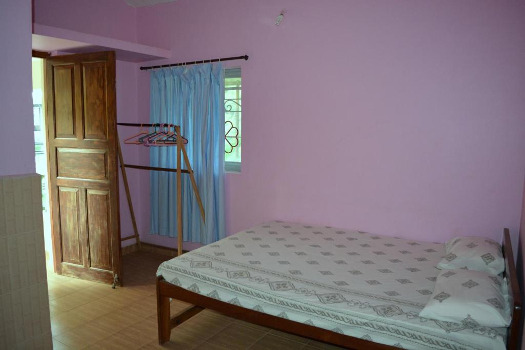 Postel nebo postele na pokoji v ubytování Vailankanni Guesthouse