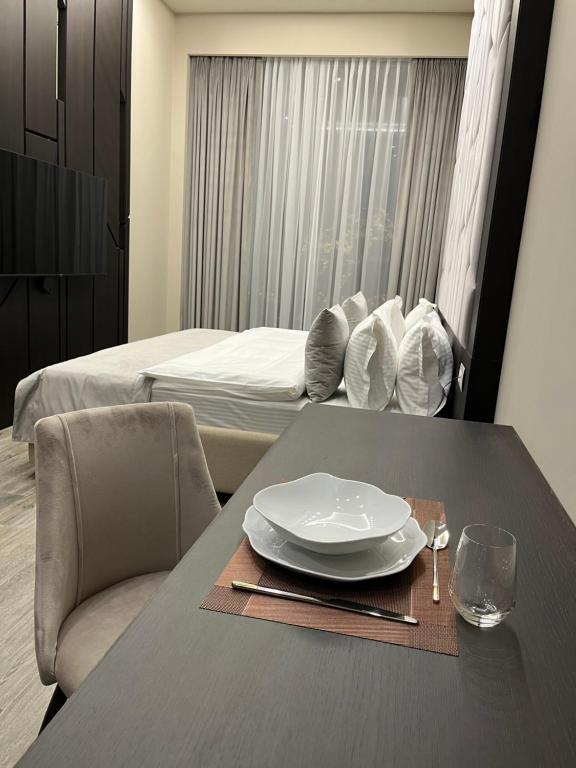 Postel nebo postele na pokoji v ubytování SOHO Hotel City Centre