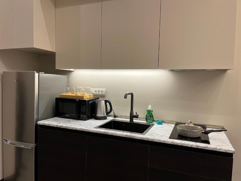 Kuchyň nebo kuchyňský kout v ubytování SOHO Hotel City Centre