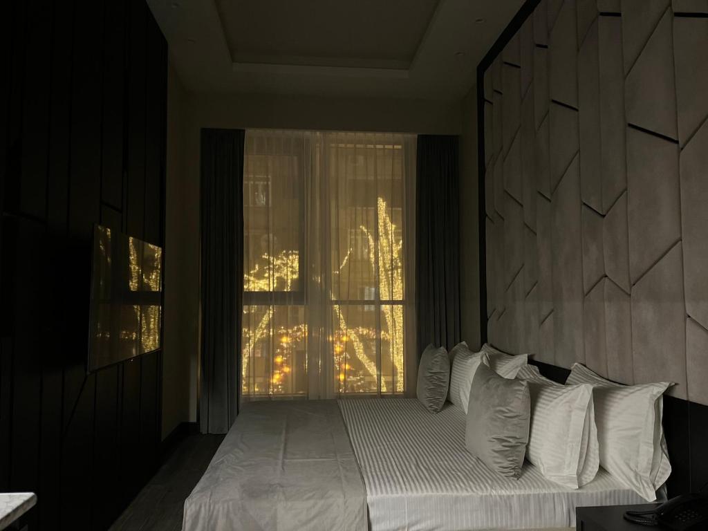 Postel nebo postele na pokoji v ubytování SOHO Hotel City Centre