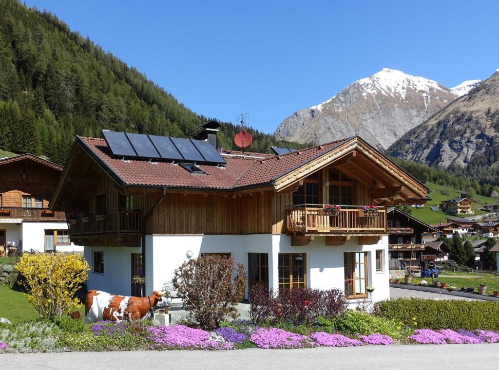 a house with solar panels on the roof at Haus Lubach in Kals am Großglockner