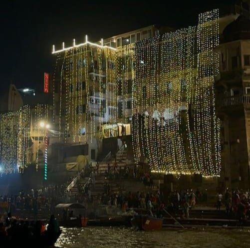 a large building covered in christmas lights at night at Hotel Sita Palace On Heritage Ghats Of Benaras in Varanasi