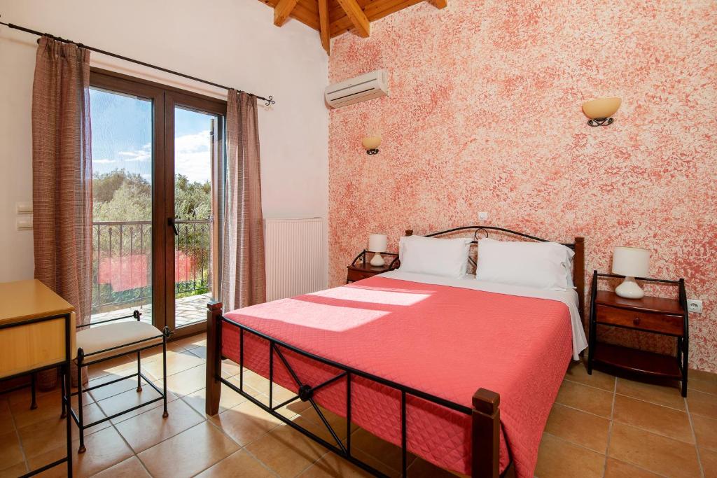 A bed or beds in a room at Olive Tree Villas