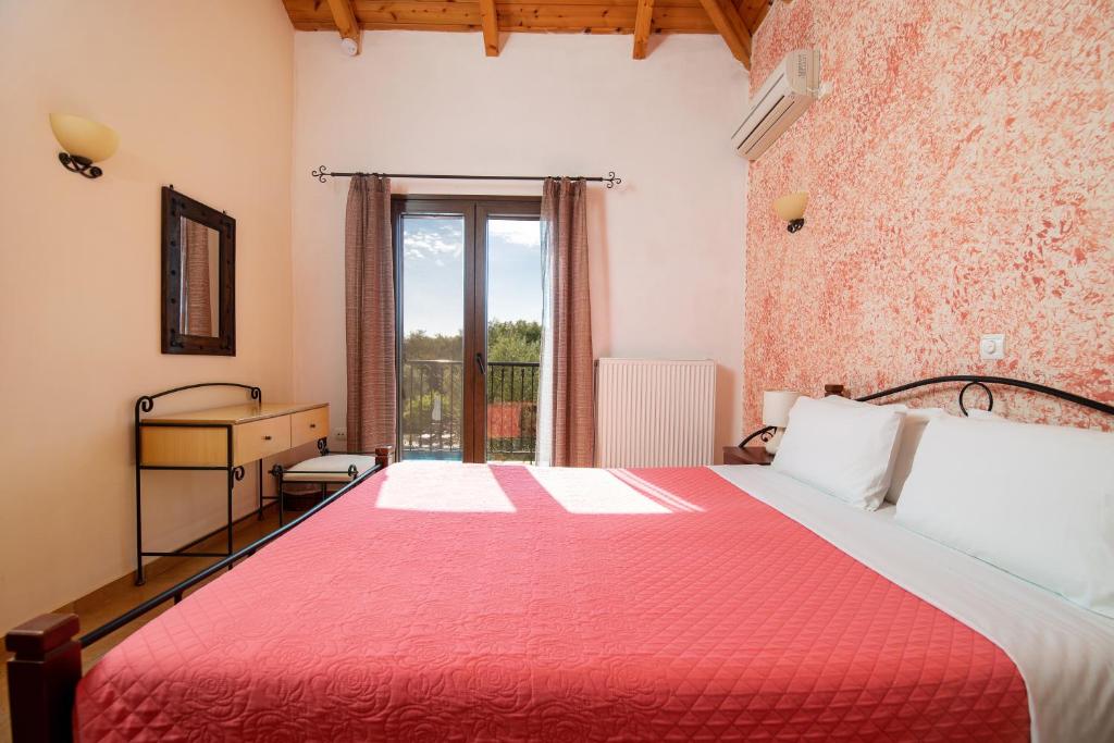 A bed or beds in a room at Olive Tree Villas