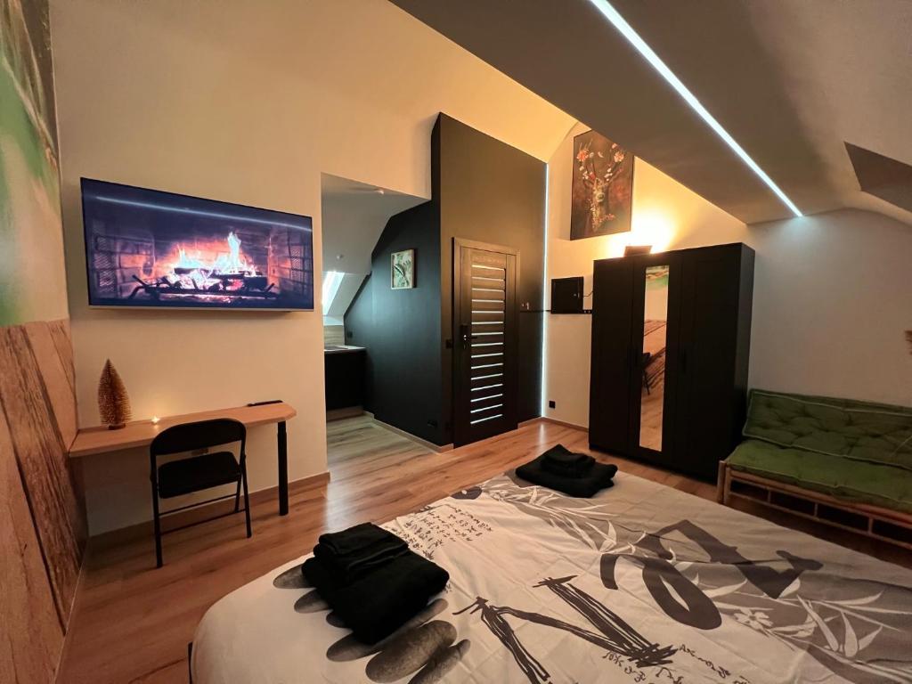 Postel nebo postele na pokoji v ubytování Zen, un studio superlatif