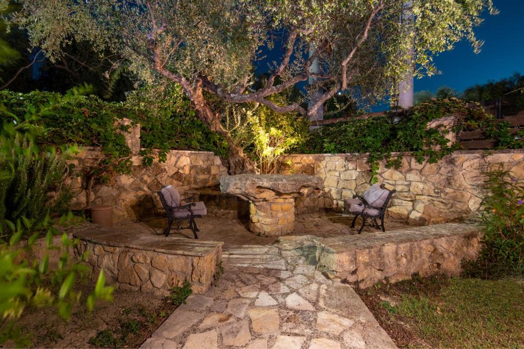 A garden outside Olive Tree Villas