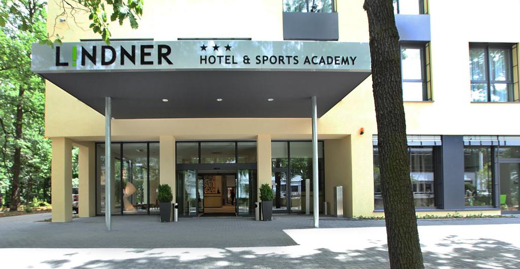 a building with a sign that reads liner hotel and sports academy at Lindner Hotel & Sports Academy in Frankfurt