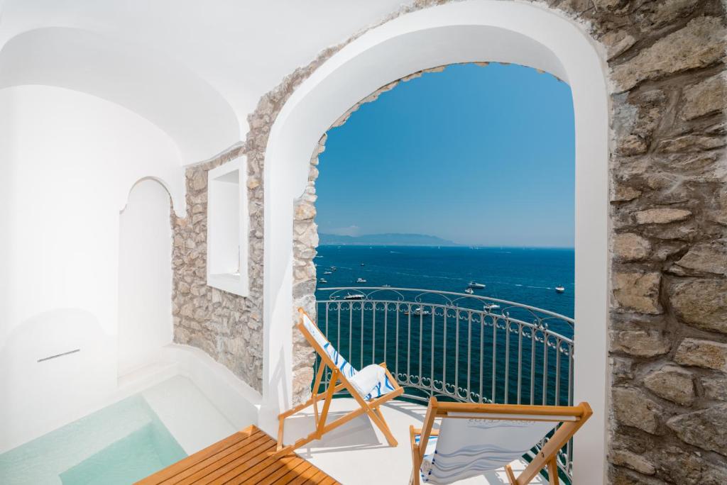 a balcony with a view of the ocean at Hotel Cetus in Cetara