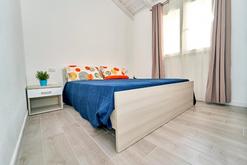 A bed or beds in a room at Affittimoderni Castelsardo La Gemma