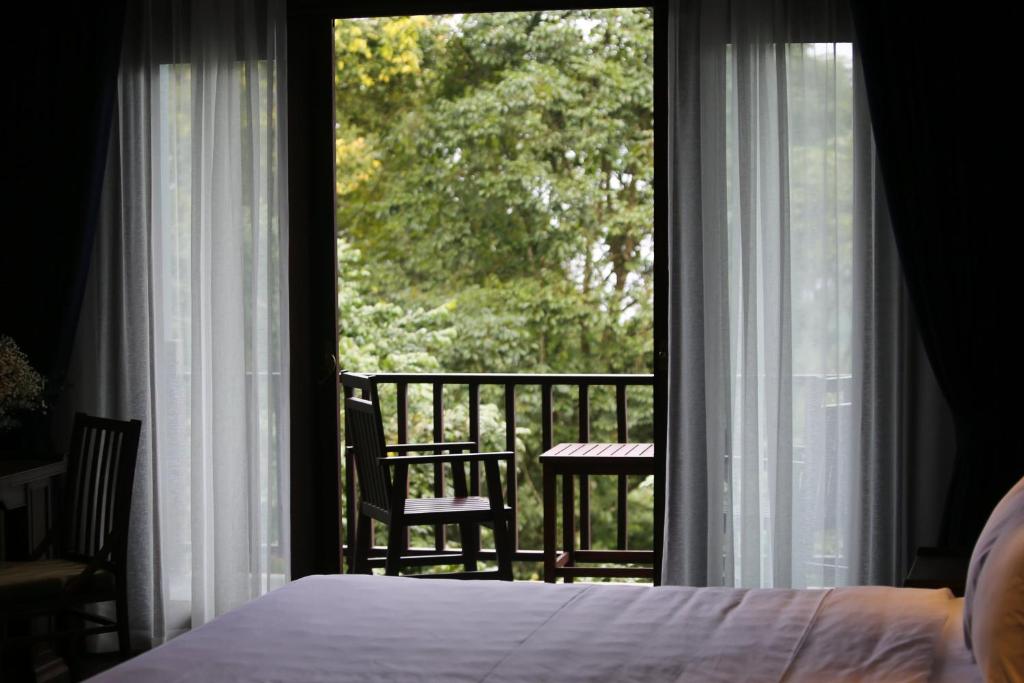 Postel nebo postele na pokoji v ubytování Amour Resort Bavi
