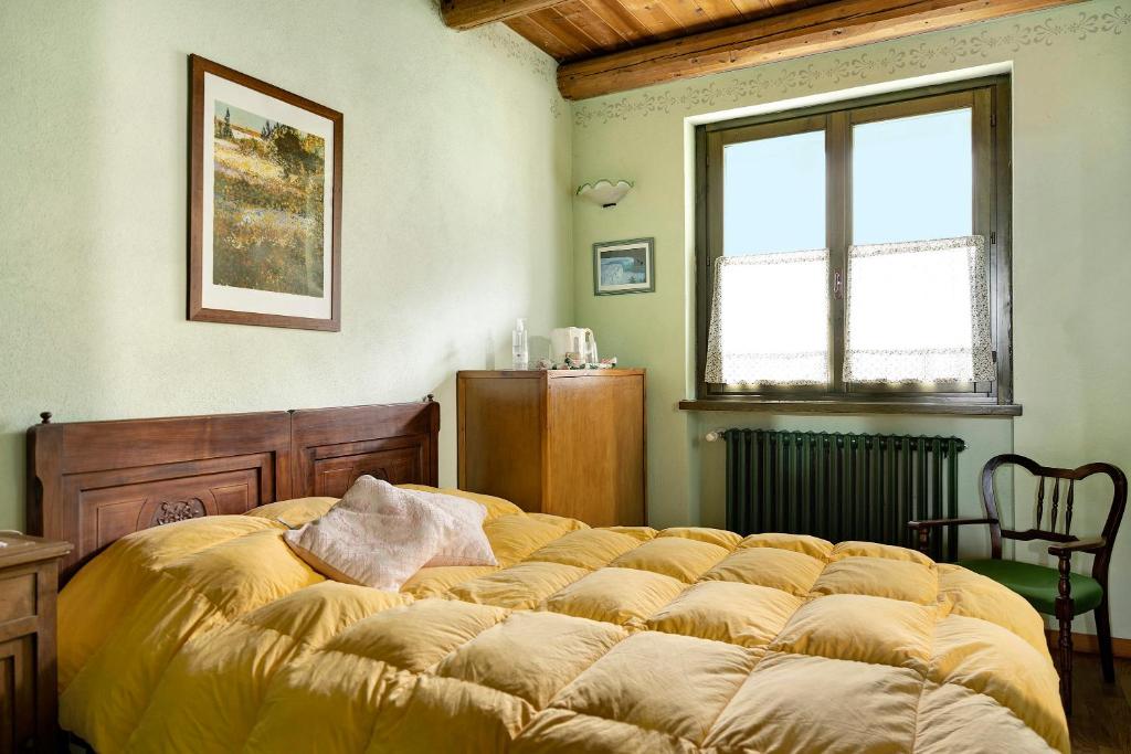 Łóżko lub łóżka w pokoju w obiekcie Casa Vacanze il Ginepro