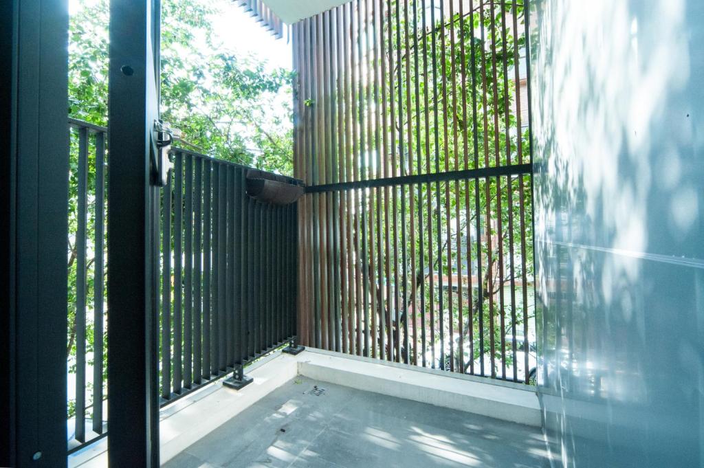 Balkón nebo terasa v ubytování 會呼吸的房-採自助式入住-有電梯