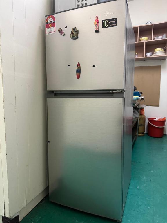 Kuchyň nebo kuchyňský kout v ubytování Pelangi Capsule Hostel
