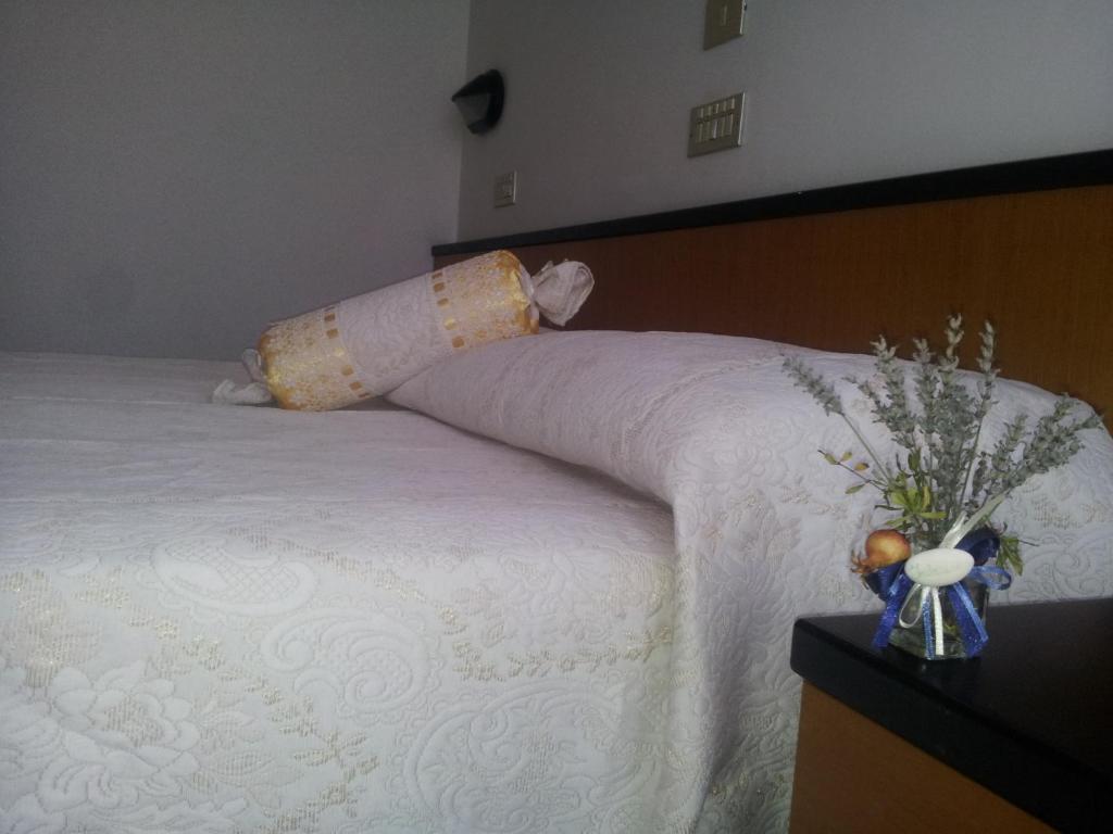 Postel nebo postele na pokoji v ubytování Hotel Montecarlo