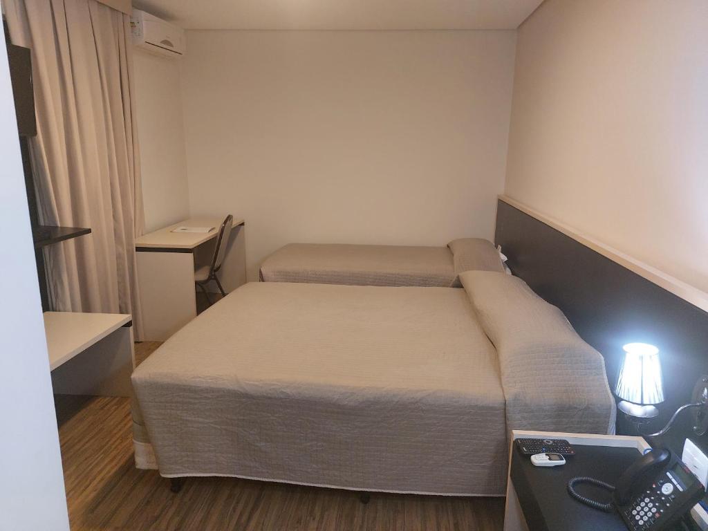 Postel nebo postele na pokoji v ubytování Hotel Financial