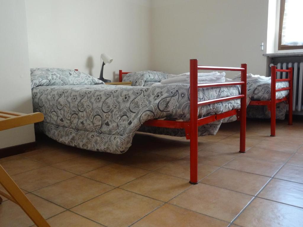 Postel nebo postele na pokoji v ubytování Ostello Cuneo