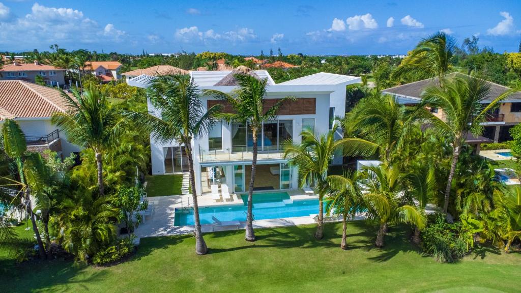 an aerial view of a house with palm trees at Best Private Cocotal Villas in Punta Cana in Punta Cana