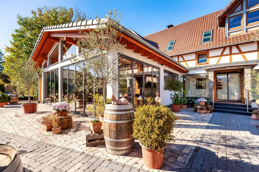 a building with a lot of plants in front of it at Landhotel zum Wagen in Achern