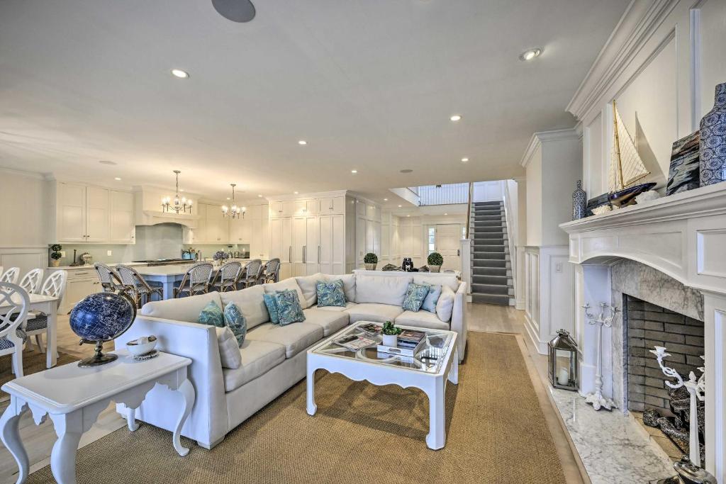 a living room with a couch and a fireplace at Shelter Island Retreat with Outdoor Pool! in Shelter Island