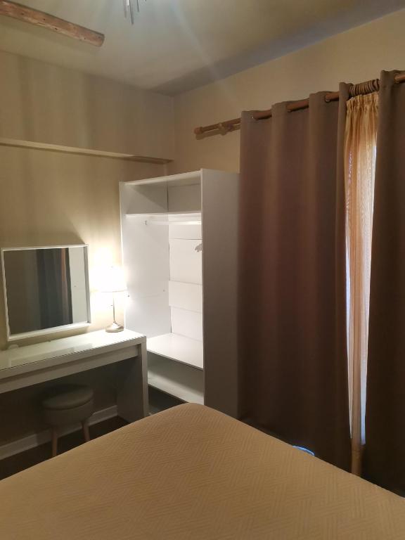 Postel nebo postele na pokoji v ubytování Ataviros Hotel