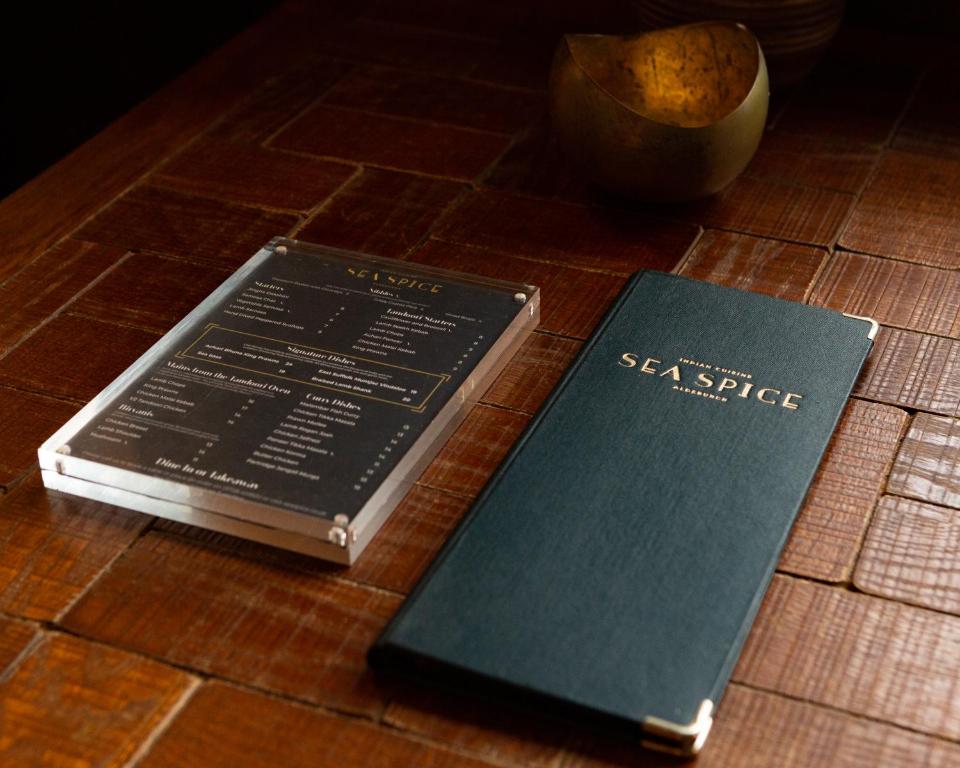 two books sitting on top of a table at The White Lion Hotel in Aldeburgh
