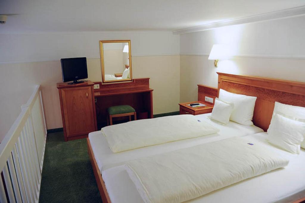Säng eller sängar i ett rum på Hotel Beethoven