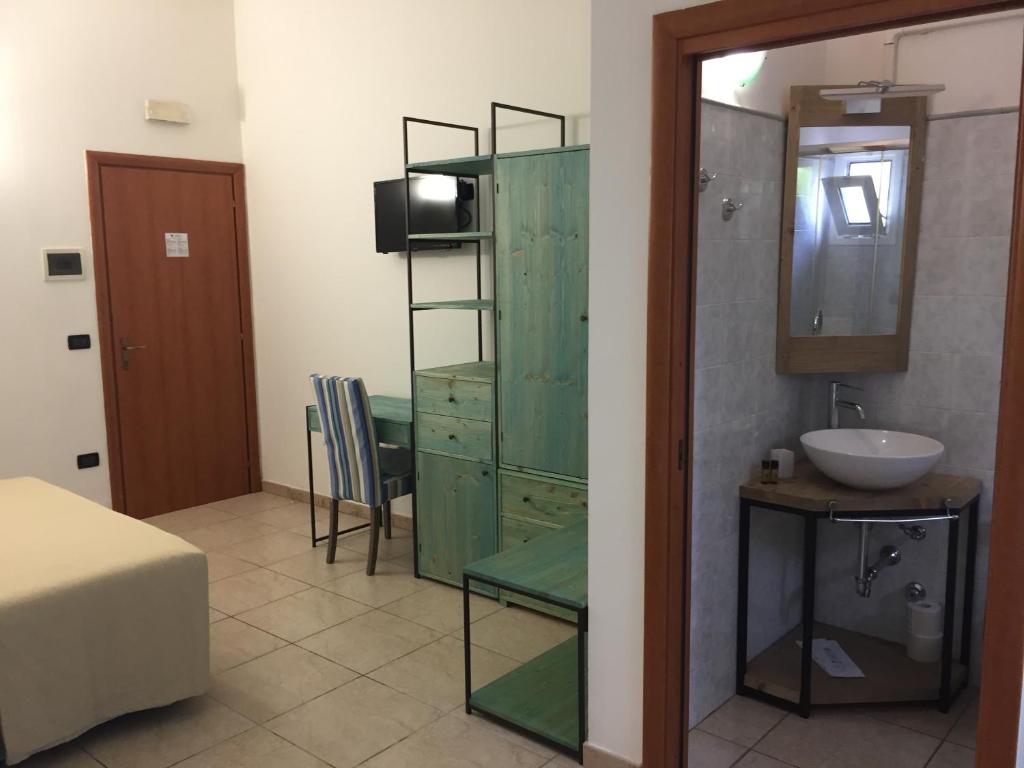 Postel nebo postele na pokoji v ubytování Hotel Universo
