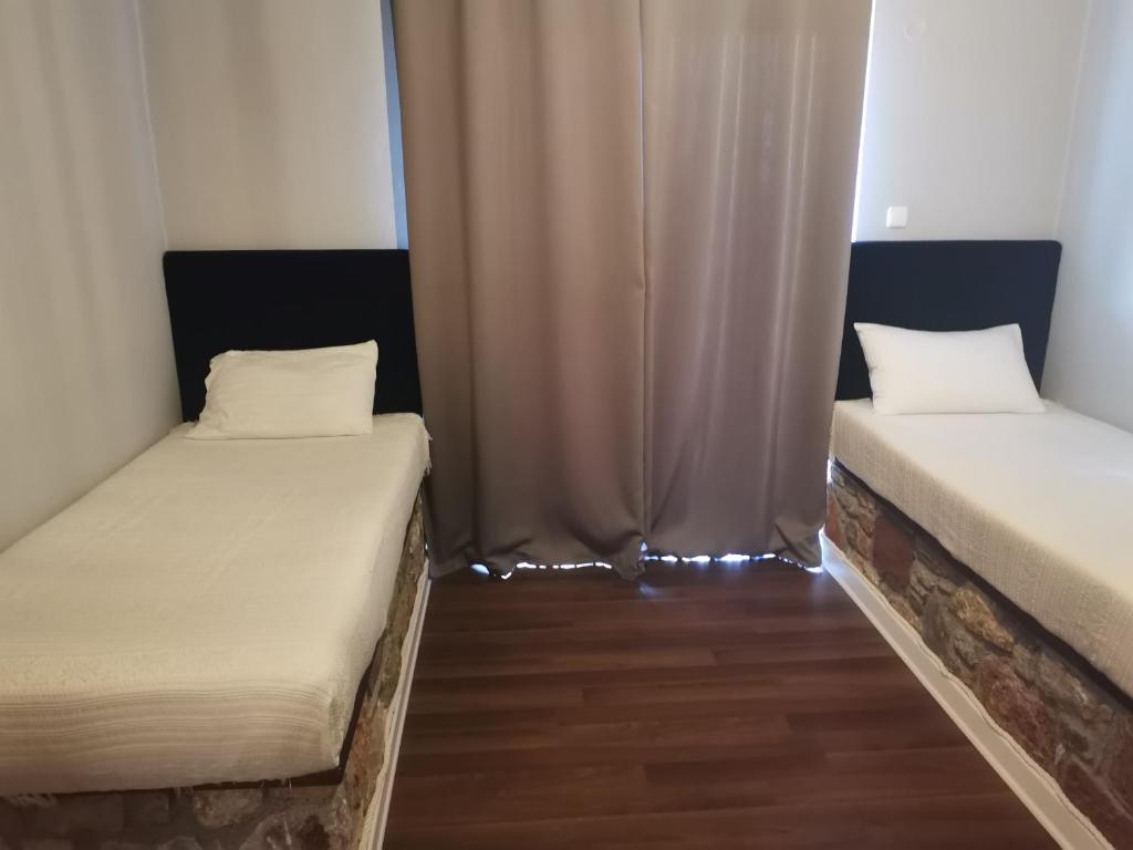 Postel nebo postele na pokoji v ubytování Ataviros Hotel