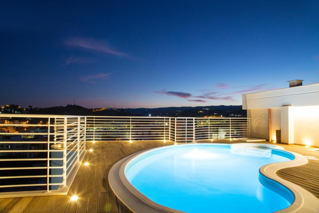 a swimming pool on the deck of a cruise ship at night at Navicri B&B in Vieste