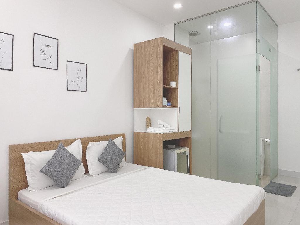 Postel nebo postele na pokoji v ubytování Hello SaiGon Homestay