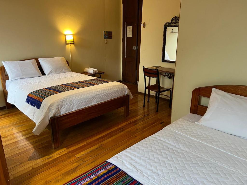 Postel nebo postele na pokoji v ubytování Mía Leticia B&B