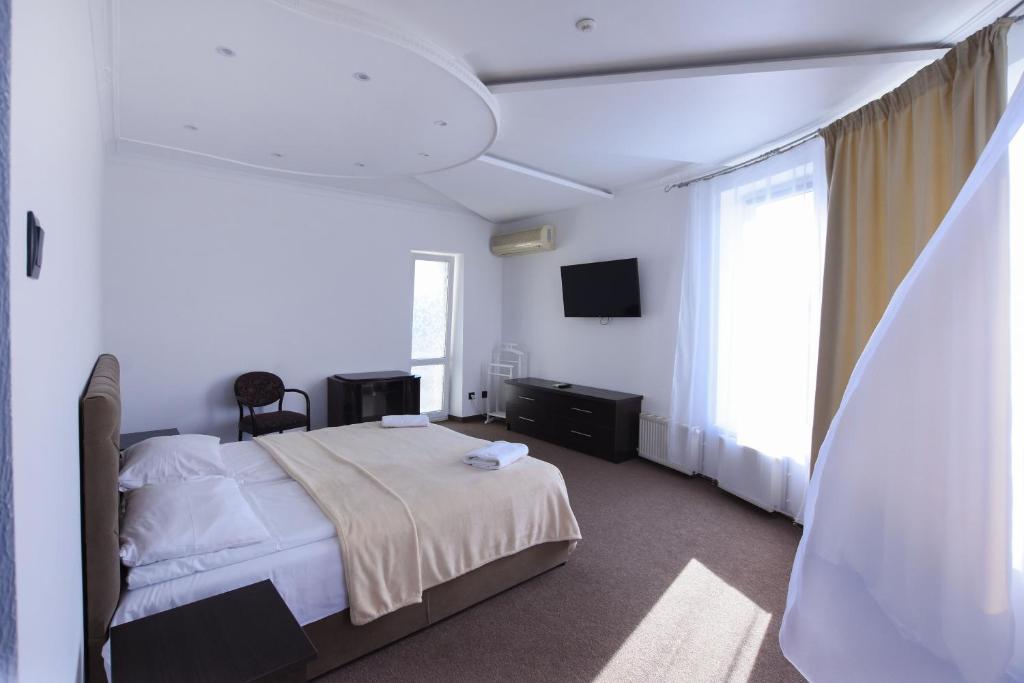 Postel nebo postele na pokoji v ubytování Hotel Continent