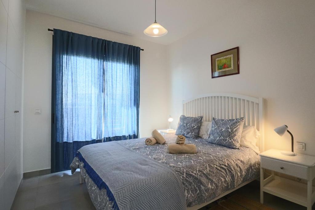 Łóżko lub łóżka w pokoju w obiekcie Enjoy La Reserva El Rompido