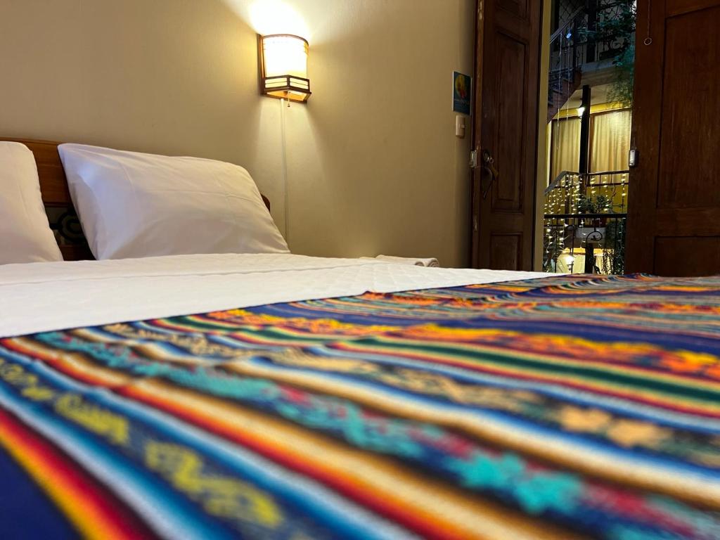 Postel nebo postele na pokoji v ubytování Mía Leticia B&B