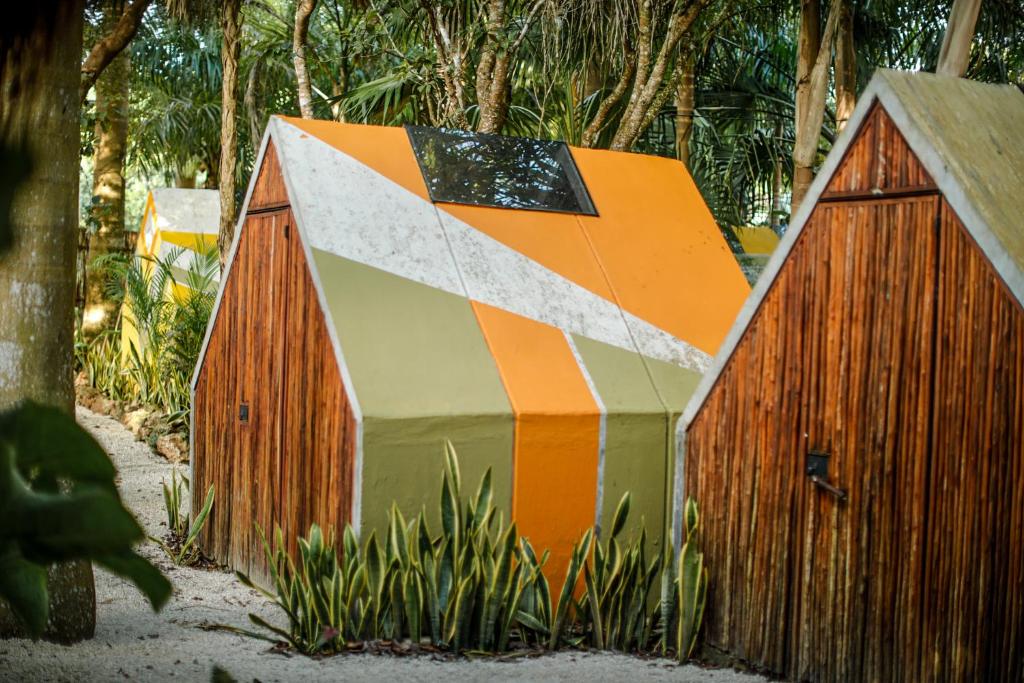 a smallshed with a geometric design on it at Totem Buenavista in Bacalar