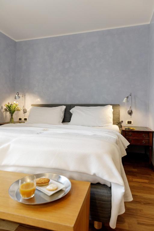 Postel nebo postele na pokoji v ubytování Hotel Palazzo Papaleo