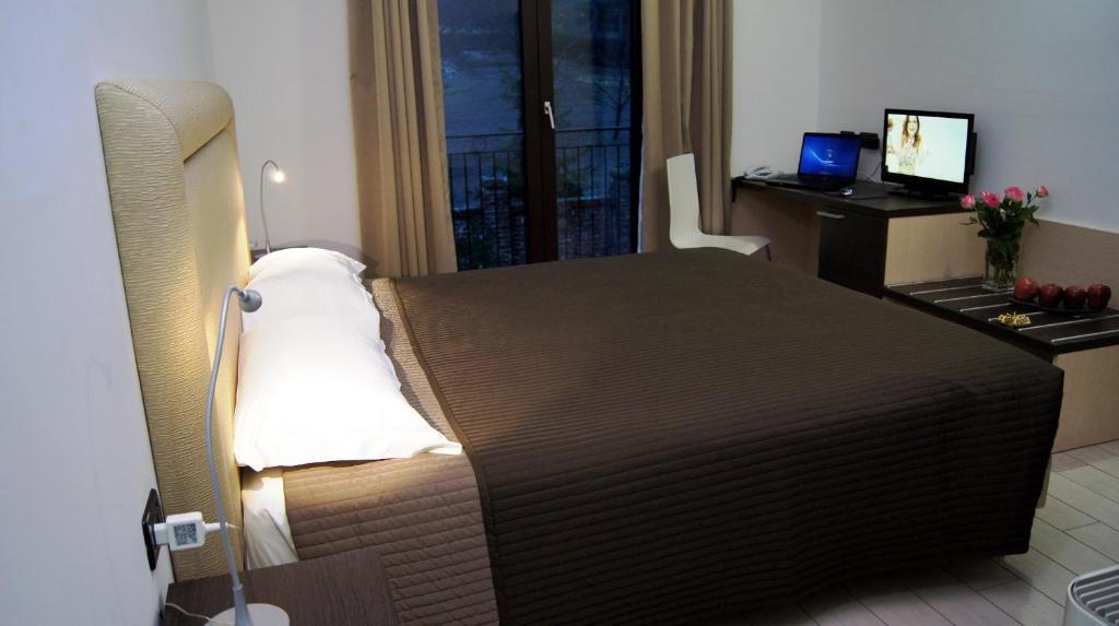 Postel nebo postele na pokoji v ubytování Hotel e trattoria San Giorgio