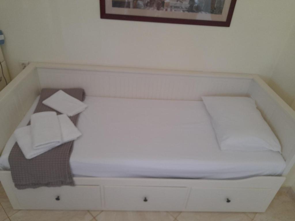 Postel nebo postele na pokoji v ubytování Apartments Giannis